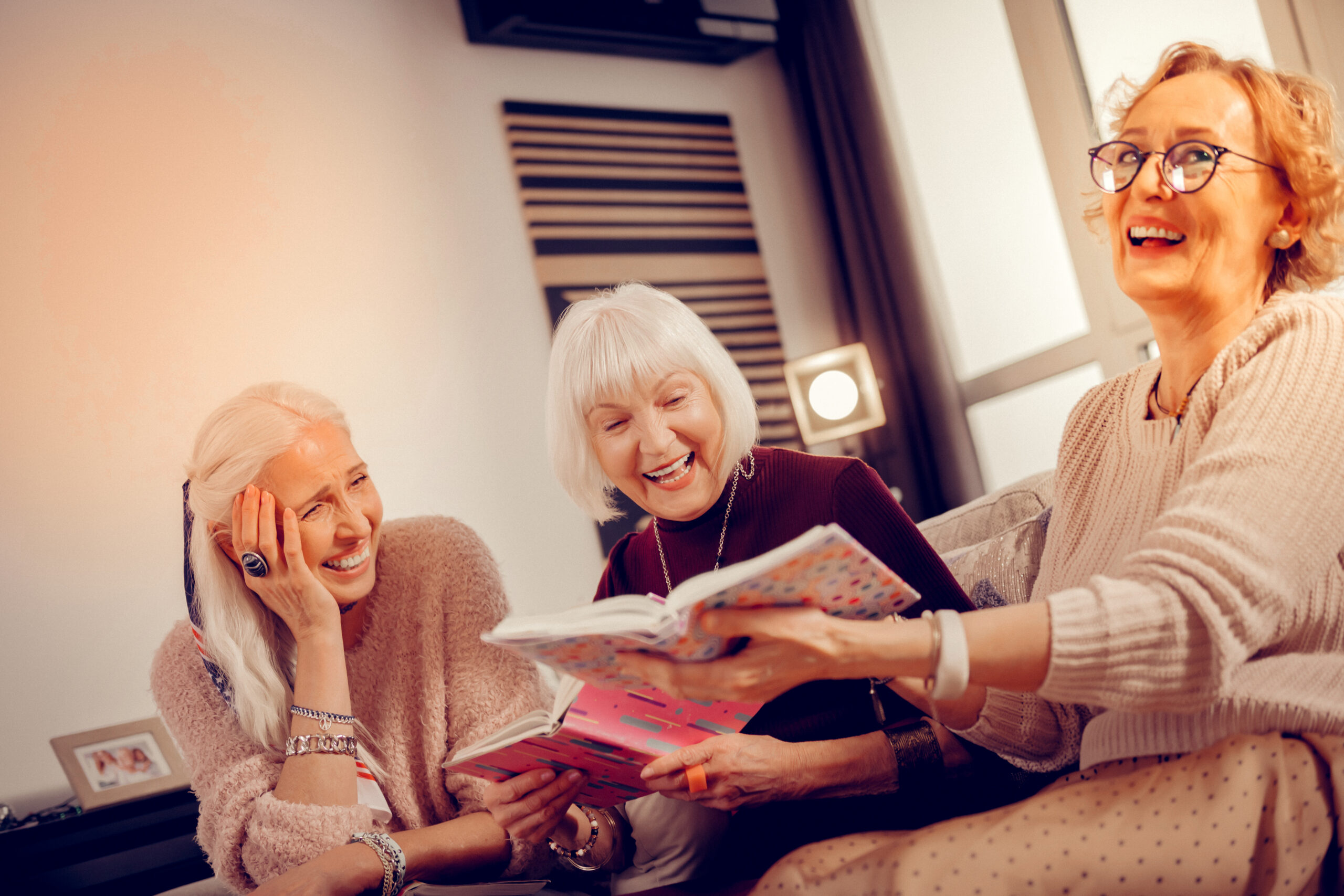 Joyful delighted woman spending time with her friends